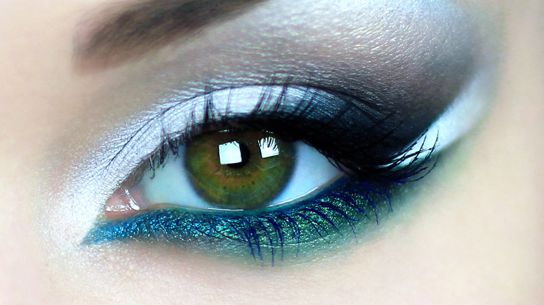 green eye with metallic eyeliner