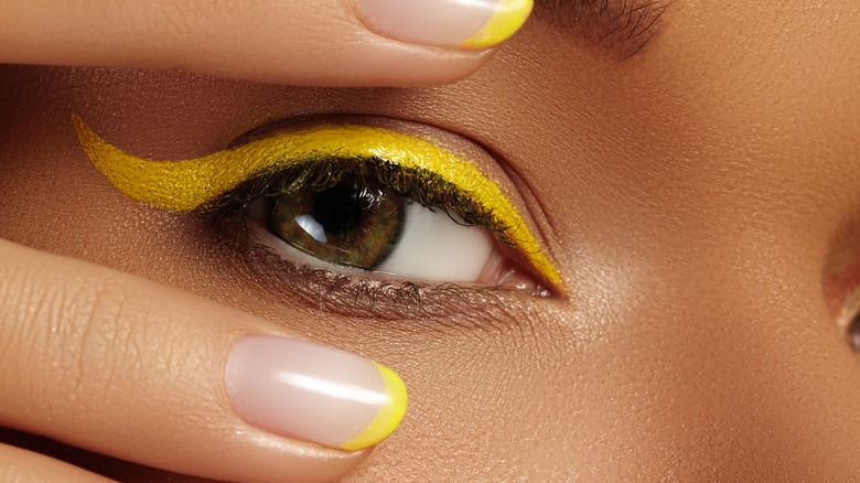 close up of bright yellow eyeliner