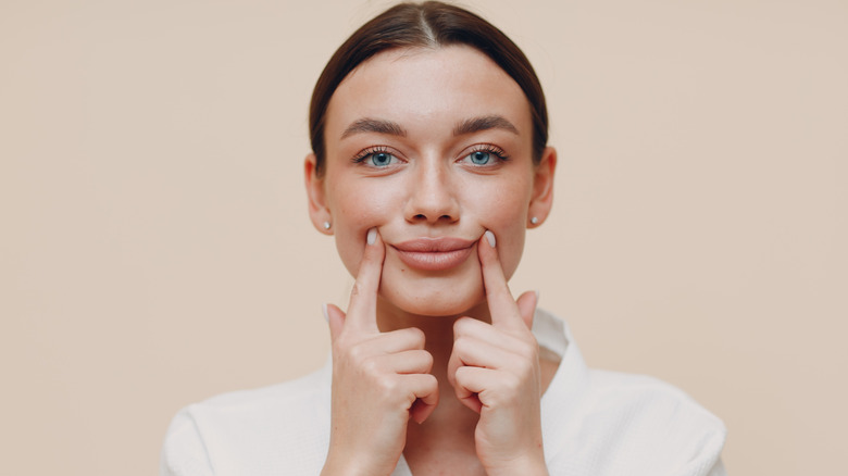 woman massage mouth