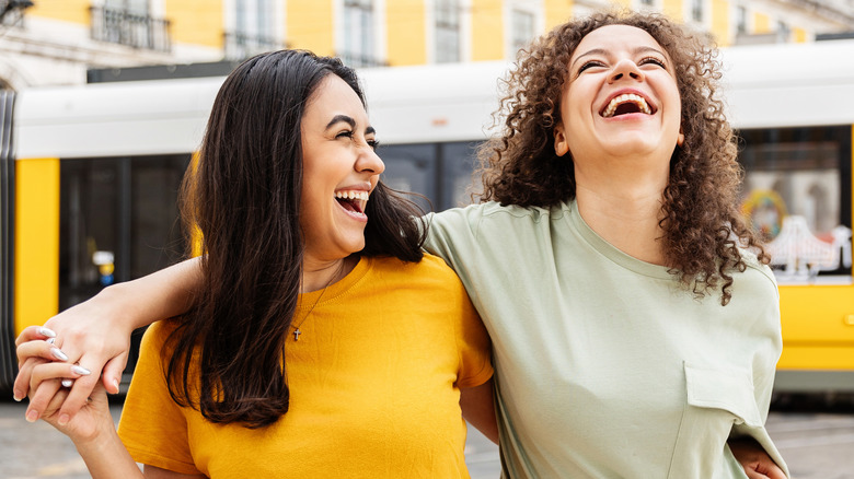 Two women laughing together