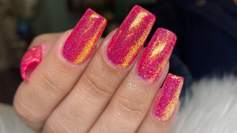 close up on hot pink glitter nails