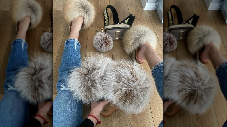 Close up of legs wearing clogs with long fur poofs