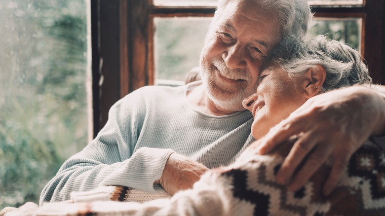 Older couple hugging