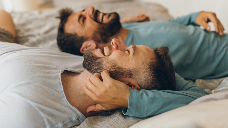 Couple embracing on bed