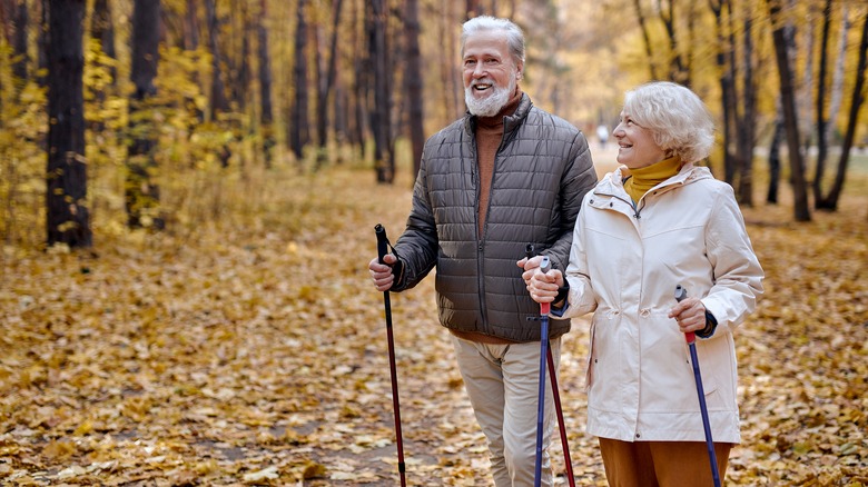 Older couple walking outside