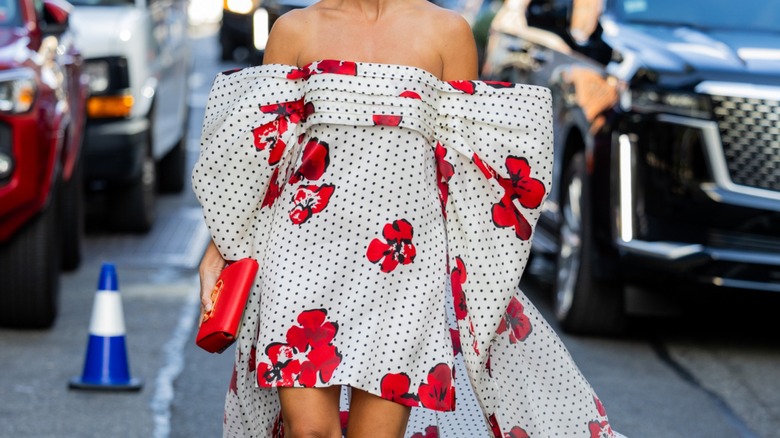 Woman wearing floral off-the-shoulder gown