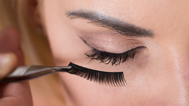 Woman with strip false lashes