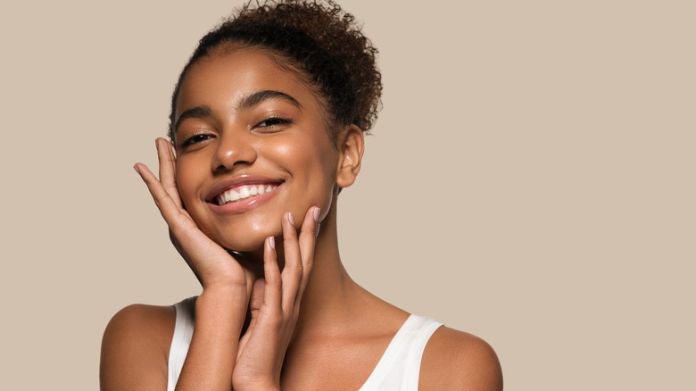 Young woman models natural makeup look