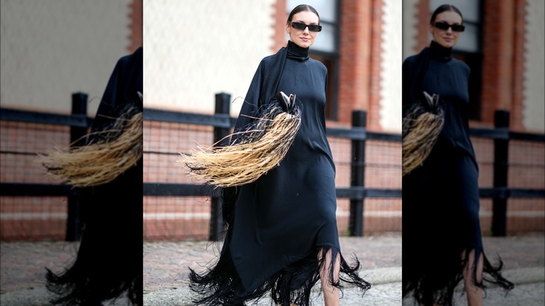 Woman wearing fringed kaftan dress