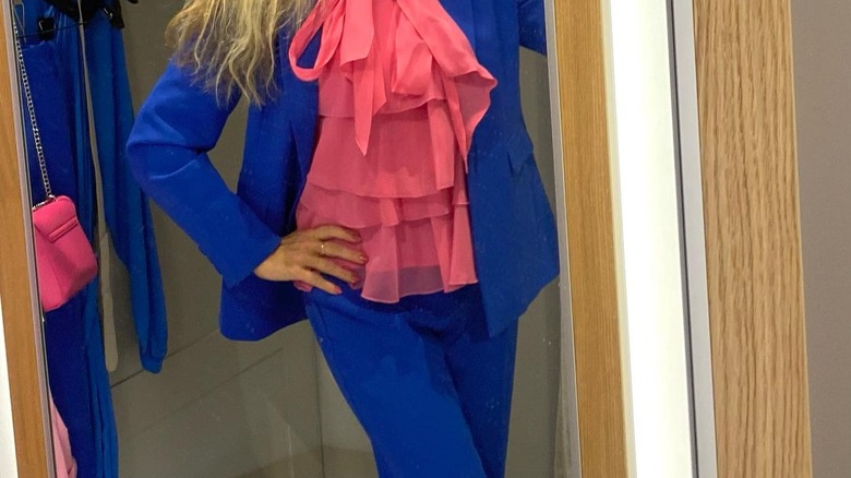 Pink top, blue jacket and pants