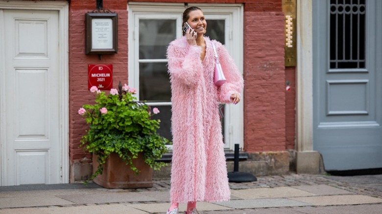 woman wearing feather coat