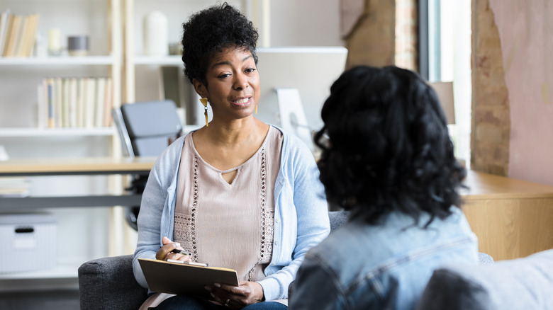 Woman speaking to therapist