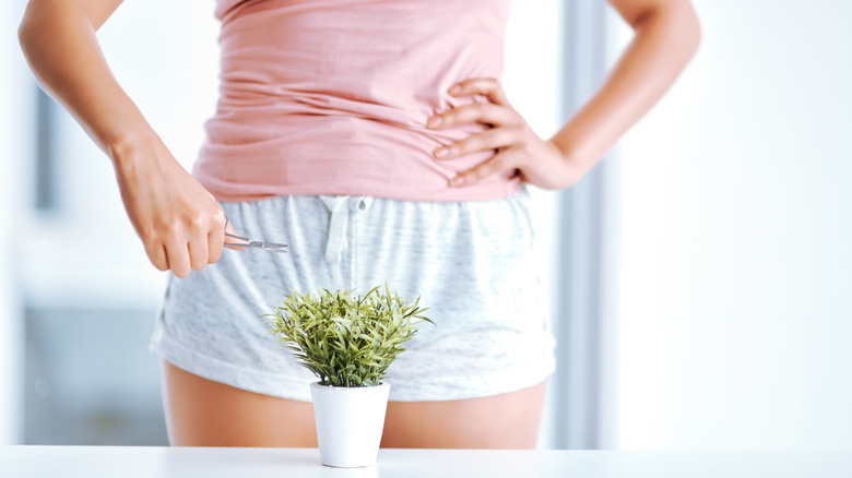 plant in front of woman