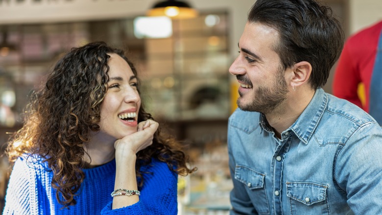 woman smiling at man