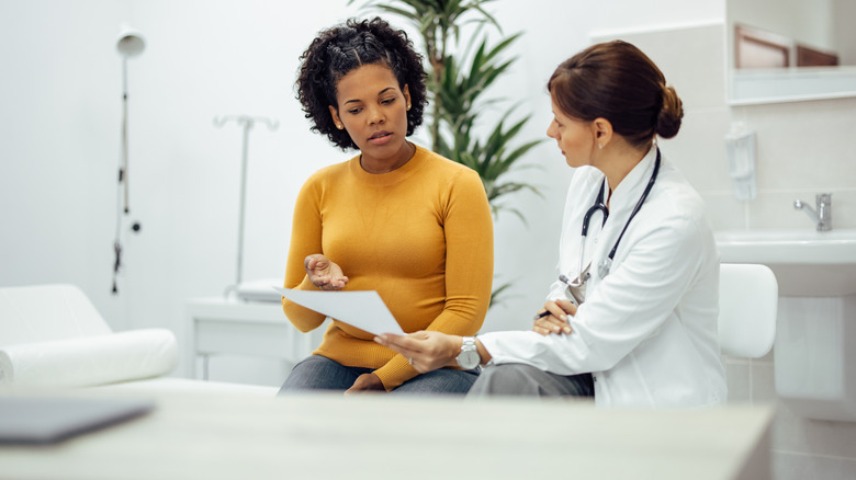 woman talking to doctor