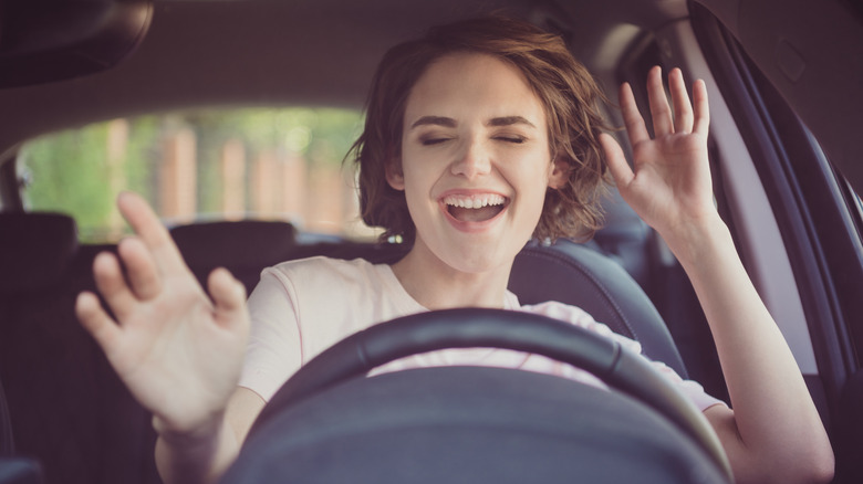 person singing in the car