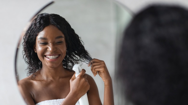 Woman styling hair