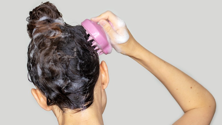 Woman massaging scalp