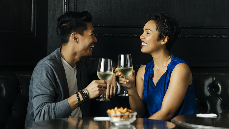 Couple sharing drink on date