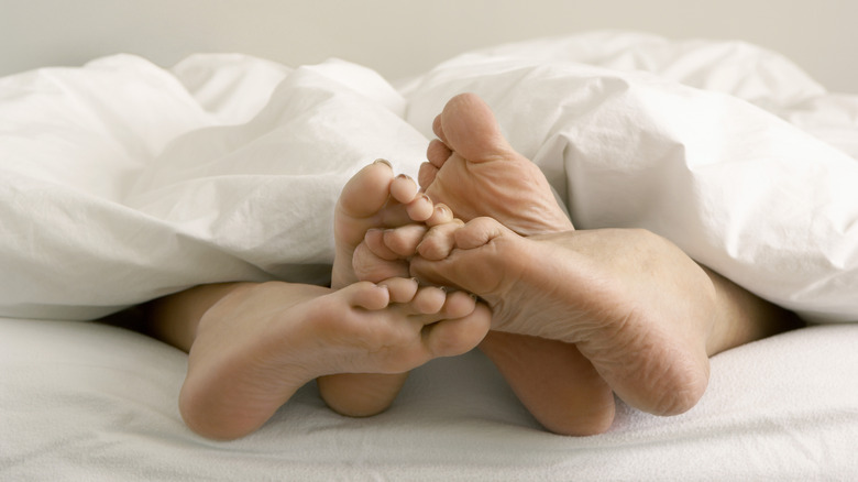 Feet poking out of bed covers