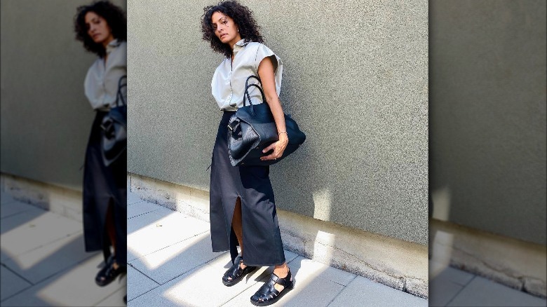 woman wearing beige outfit with black fisherman sandals