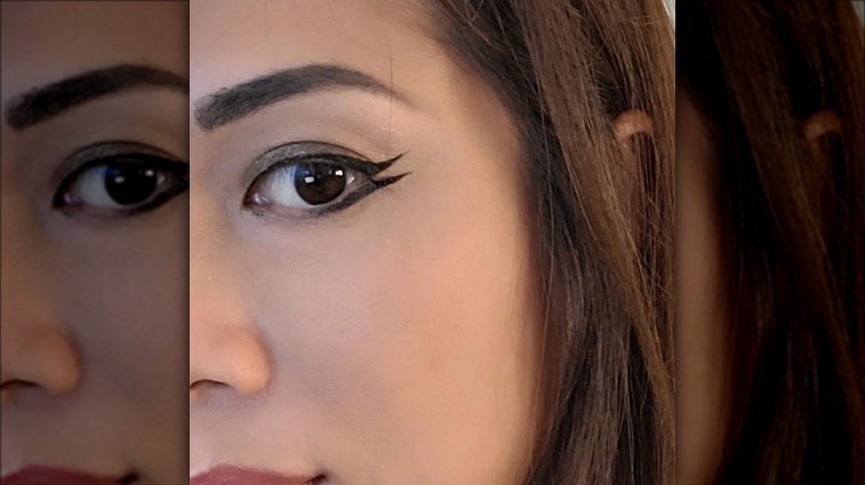 woman with fishtail eyeliner