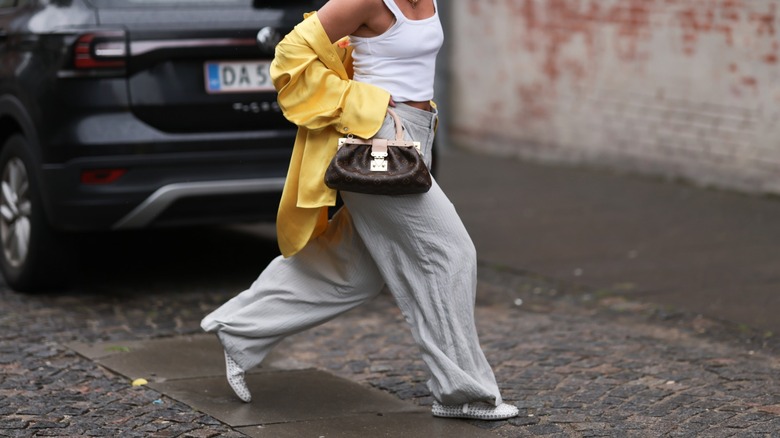 woman wearing bedazzled flats