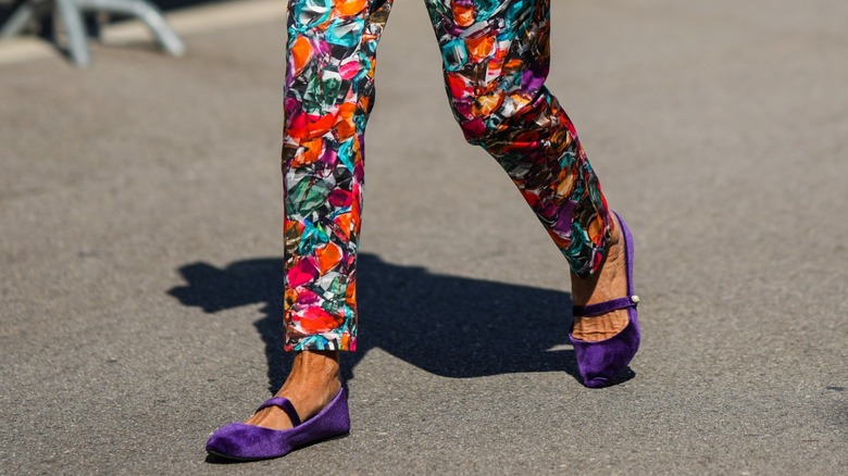 woman wearing purple flats