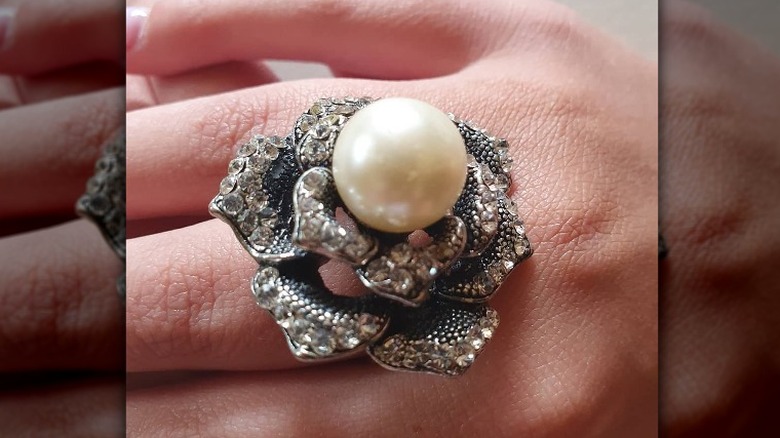 Instagram user @retro_rummage_clothing showing cocktail ring with pearl center