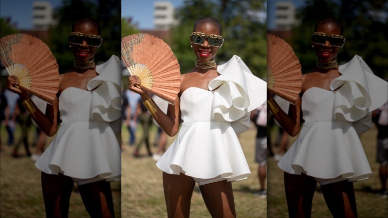 woman with a textured folding fan