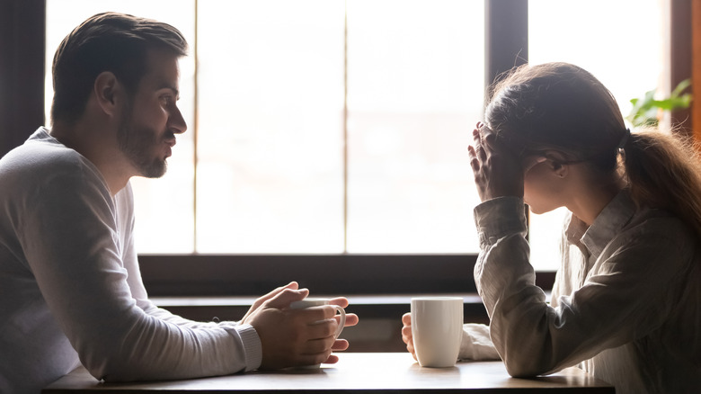 Sad couple at a coffee shop