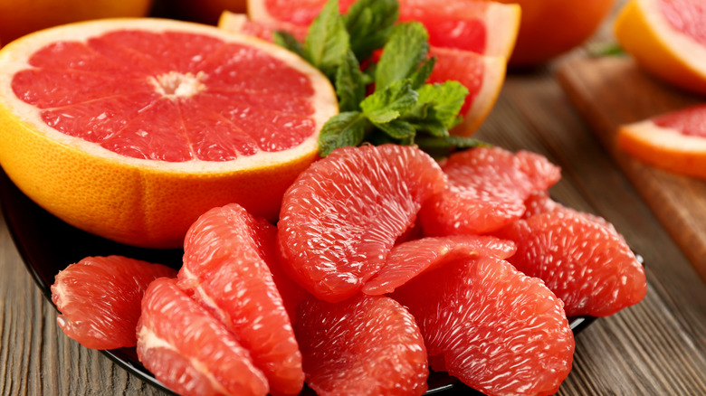 Red grapefruit sections and mint leaves