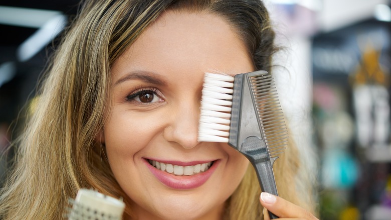 Woman with wide-tooth comb 