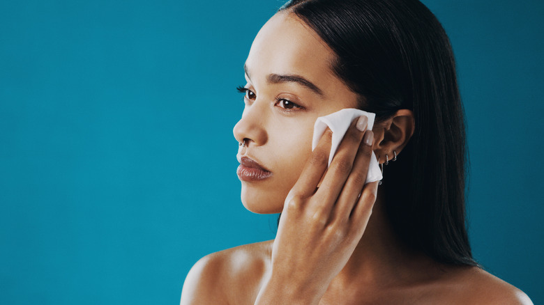 A woman removing her makeup