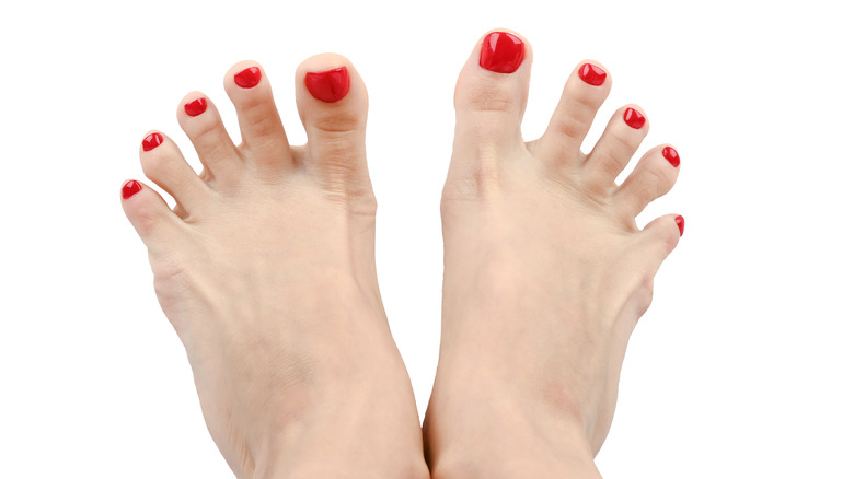 Feet with spread toes and red nails