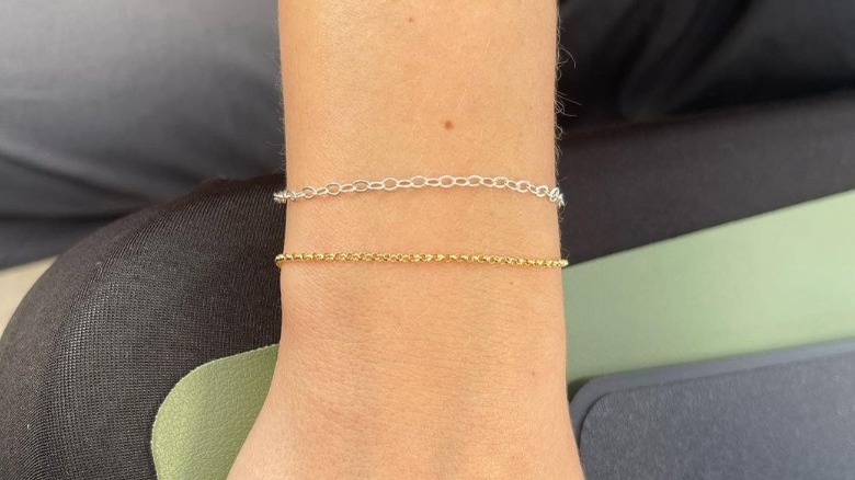 Wrist with two delicate bracelets