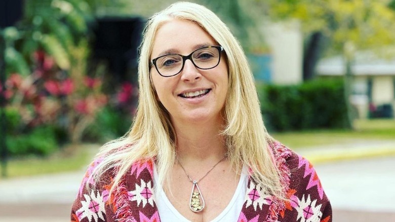 Woman wears silver and gold necklace 