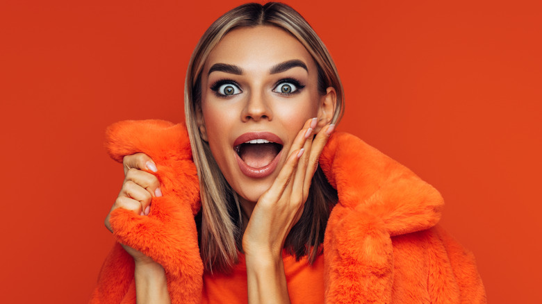 woman with orange-hued makeup