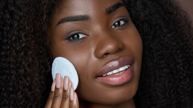 Woman applying foundation