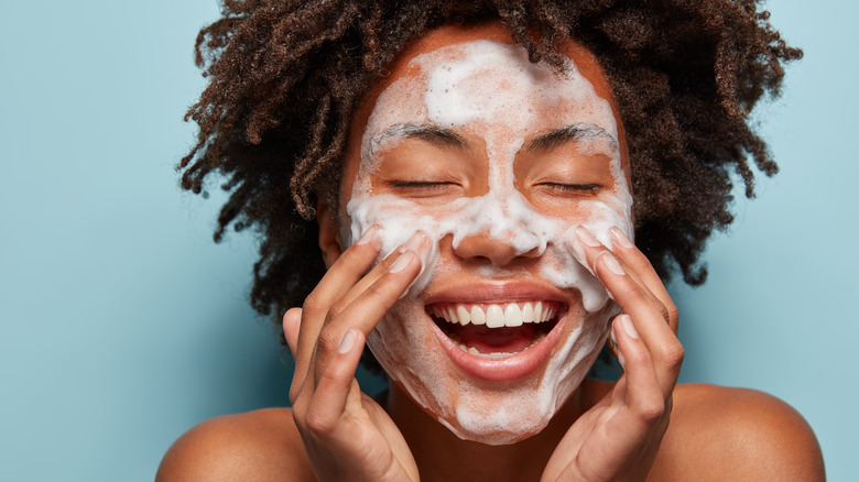 Woman washing her face