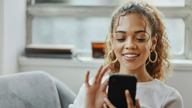 woman scrolling on phone 