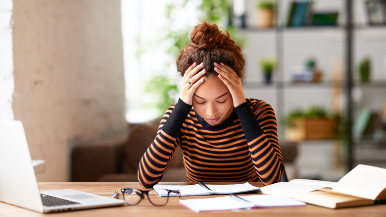 Stressed woman at desk