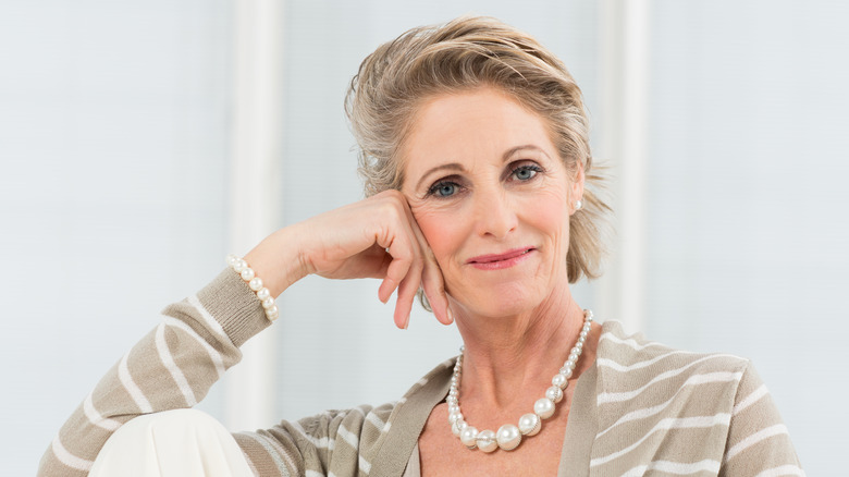 Woman wearing pearl necklace 