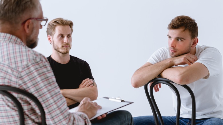 Men in a therapy session