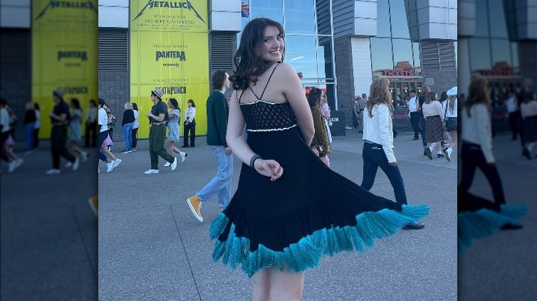 Woman in LBD, teal fringe trim