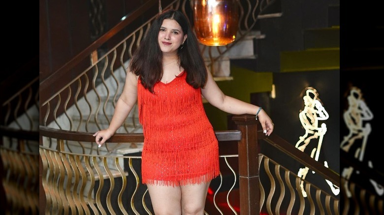 Woman in red fringe dress 