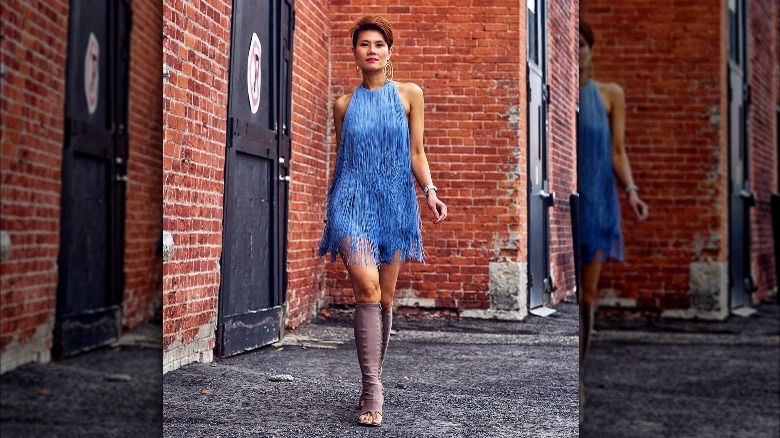 Woman in blue fringe dress