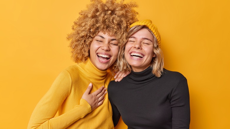 Two women smiling