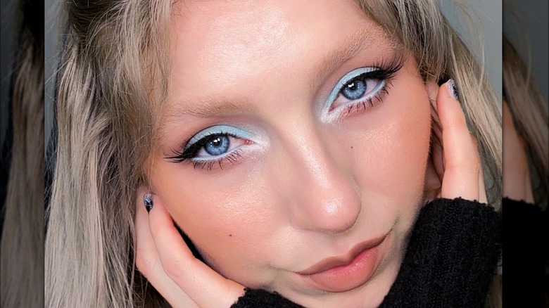 Woman with frosted blue eyeshadow