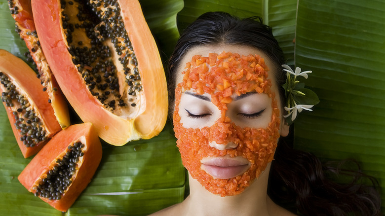 Woman receiving papaya facial